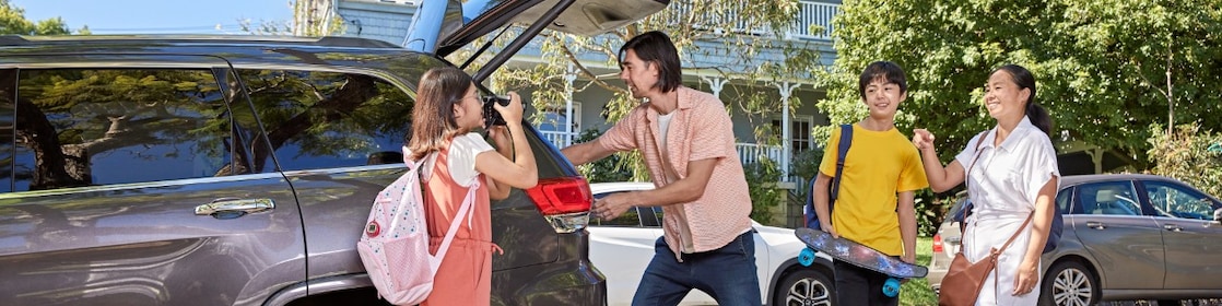 People Loading luggage in car