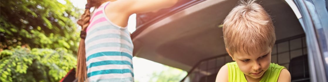 Young children cleaning a car