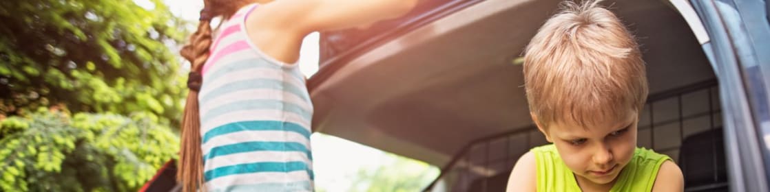 Young children cleaning a car