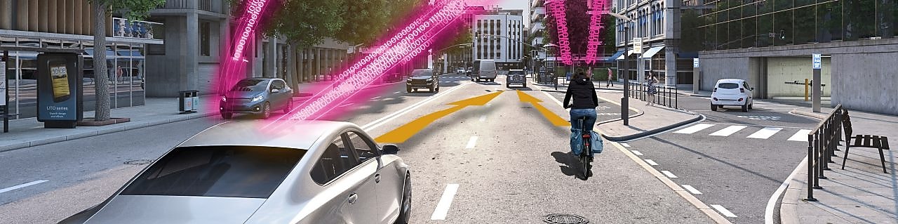A car and a cyclist on a city road both receive a collision warning via advanced sensor tech