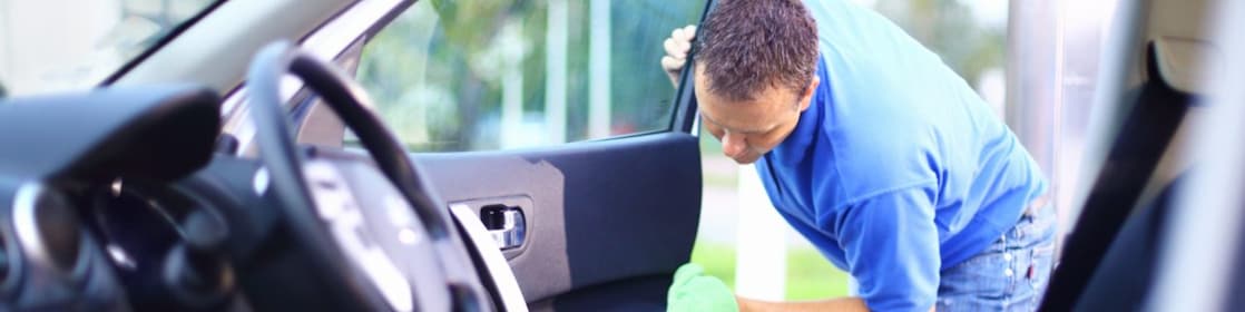 Man cleaning a car