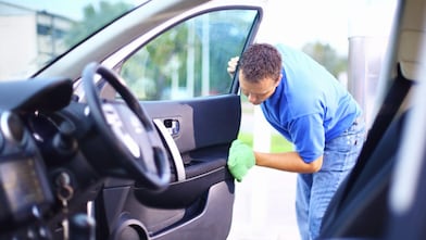 Man cleaning a car