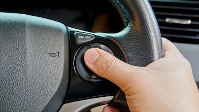 Car Mechanic Working Under Vehicle