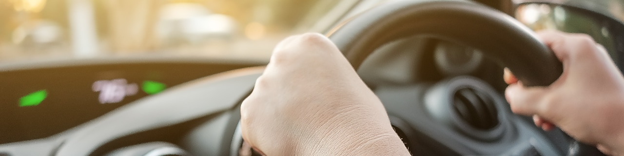 hands on the car wheel