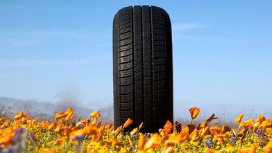Woman rotating tyre