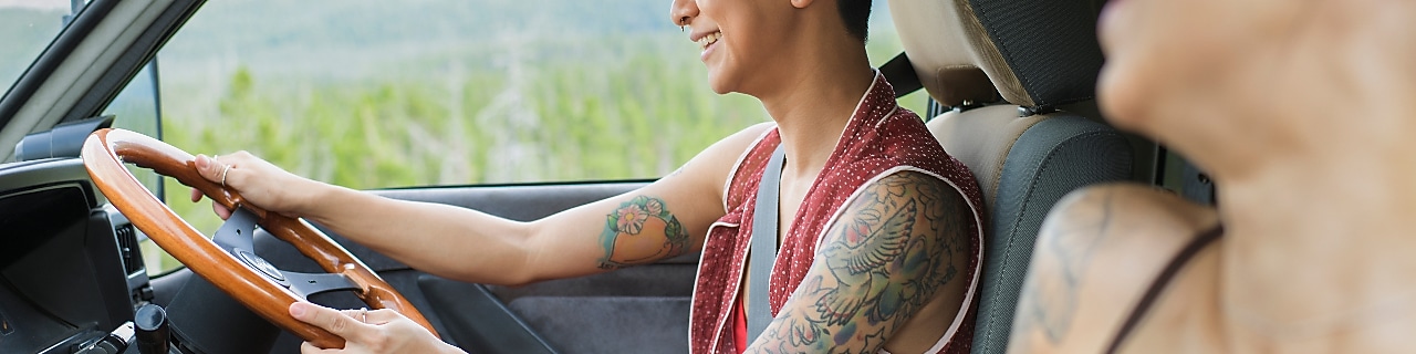 Two young women driving in camper van