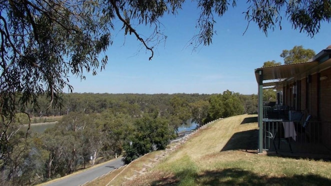 Image of cabin balcony overlooking lake Talbot
