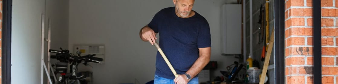 Man cleaning garage