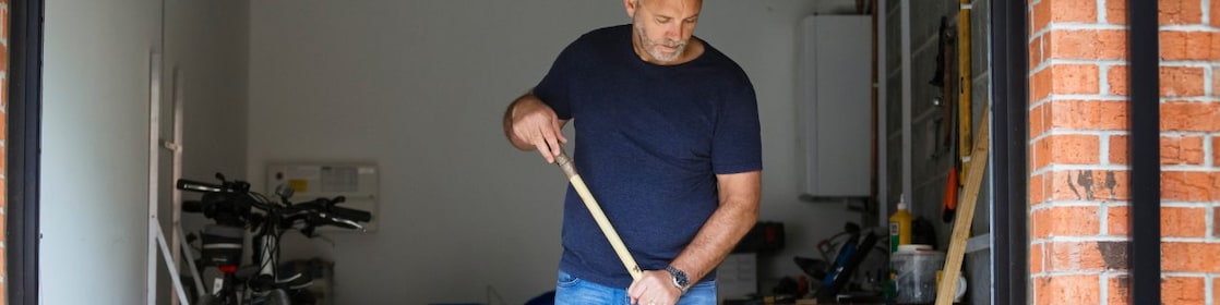 Man cleaning garage
