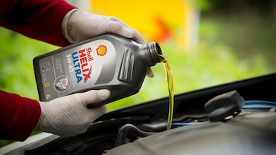 Filling up a car with Shell Helix