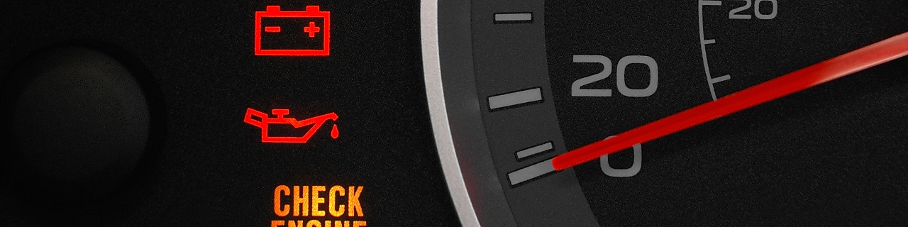 A detailed view of a car dashboard featuring a glowing check engine light, signaling the need for vehicle maintenance.