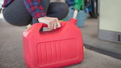 Person filling up a portable fuel container