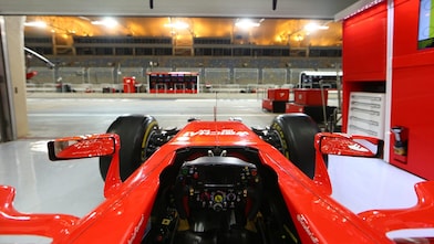 Scuderia Ferrari F1 car in garage