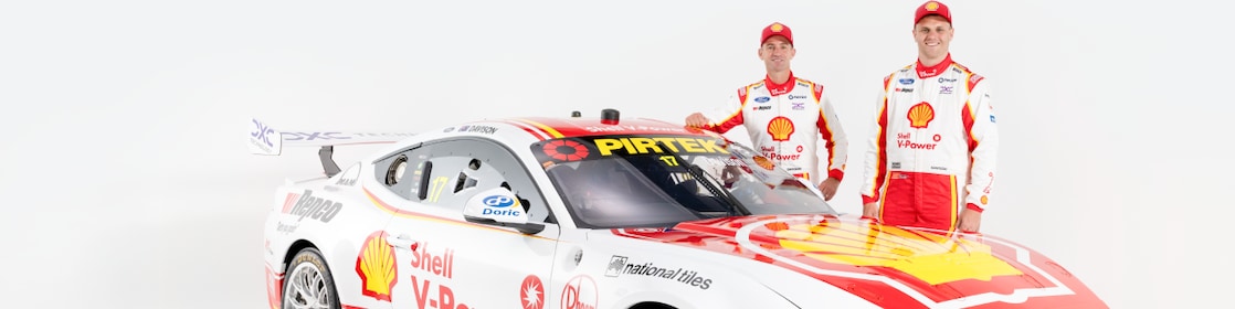 red sports car with shell v power logo back view