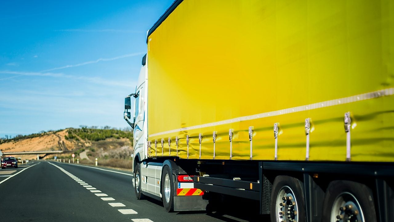 Yellow truck on the road