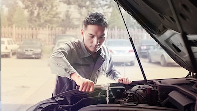 mechanic fixing a car