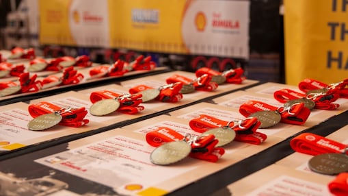 A table of Shell Rimula Wall of Fame medals and certificates