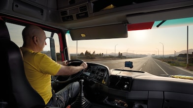 truck driver driving on empty road