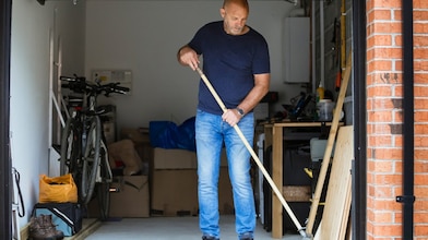 Man cleaning garage