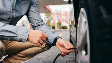 Man inflating tyre