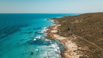 An aerial view of the road that follows the coastline in Eagle Bay, Western Australia.