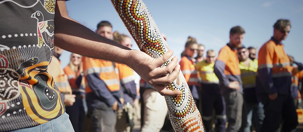 a-group-of-men-with-white-body-paint-clapping