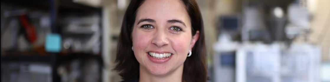 Female CEO of Jim's Jerky, Emily Pullen smiling at work