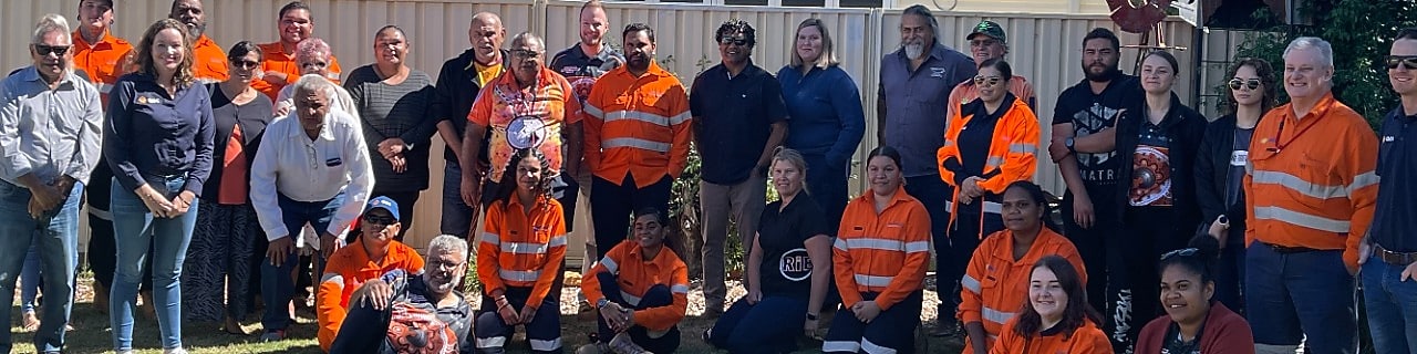 worker on a site writing on a paper while standing