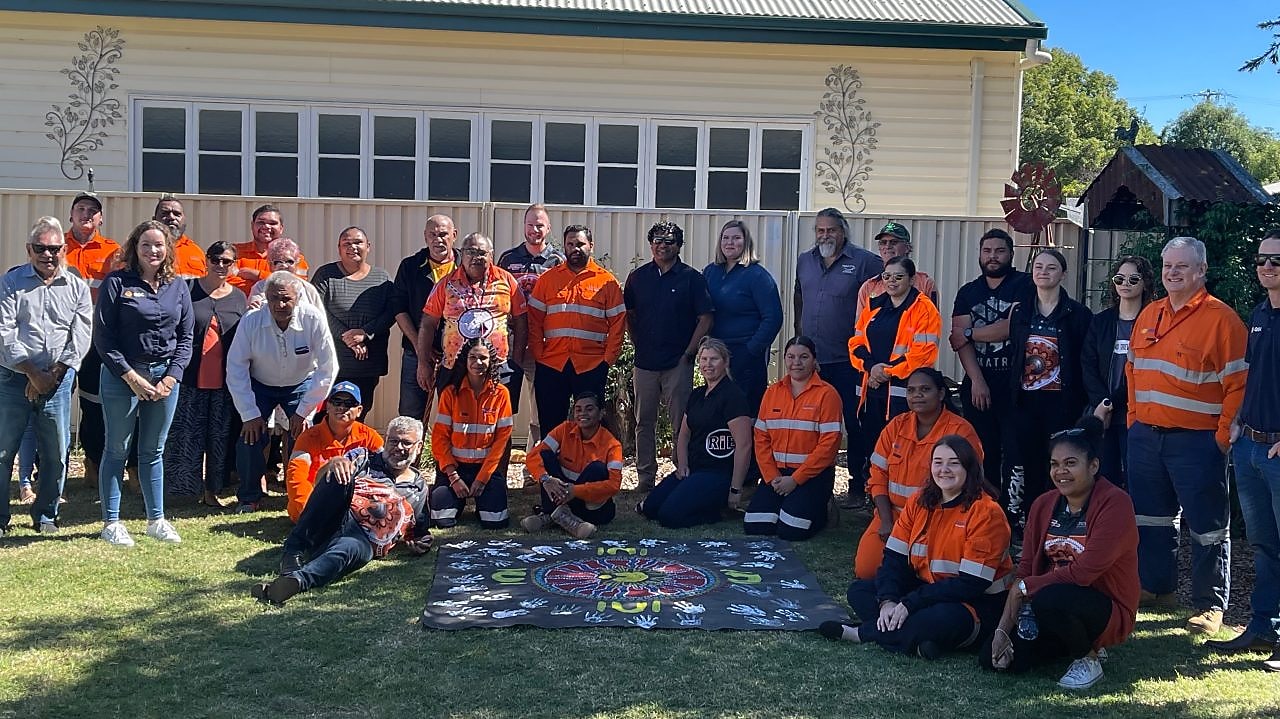 worker on a site writing on a paper while standing